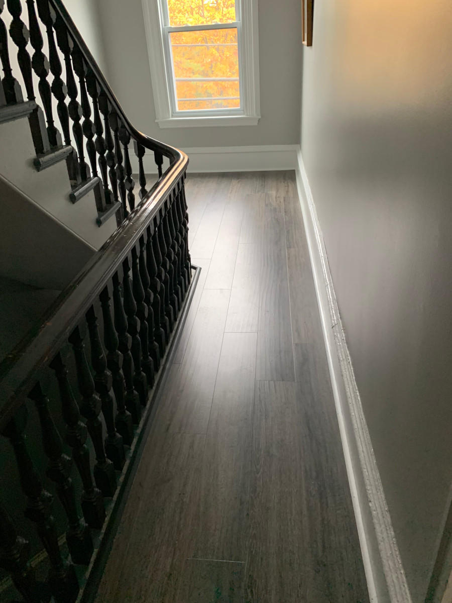 For this residence in Haverhill, MA, our handyman installed a new laminate floor and trim. He also painted the walls to finish the job.