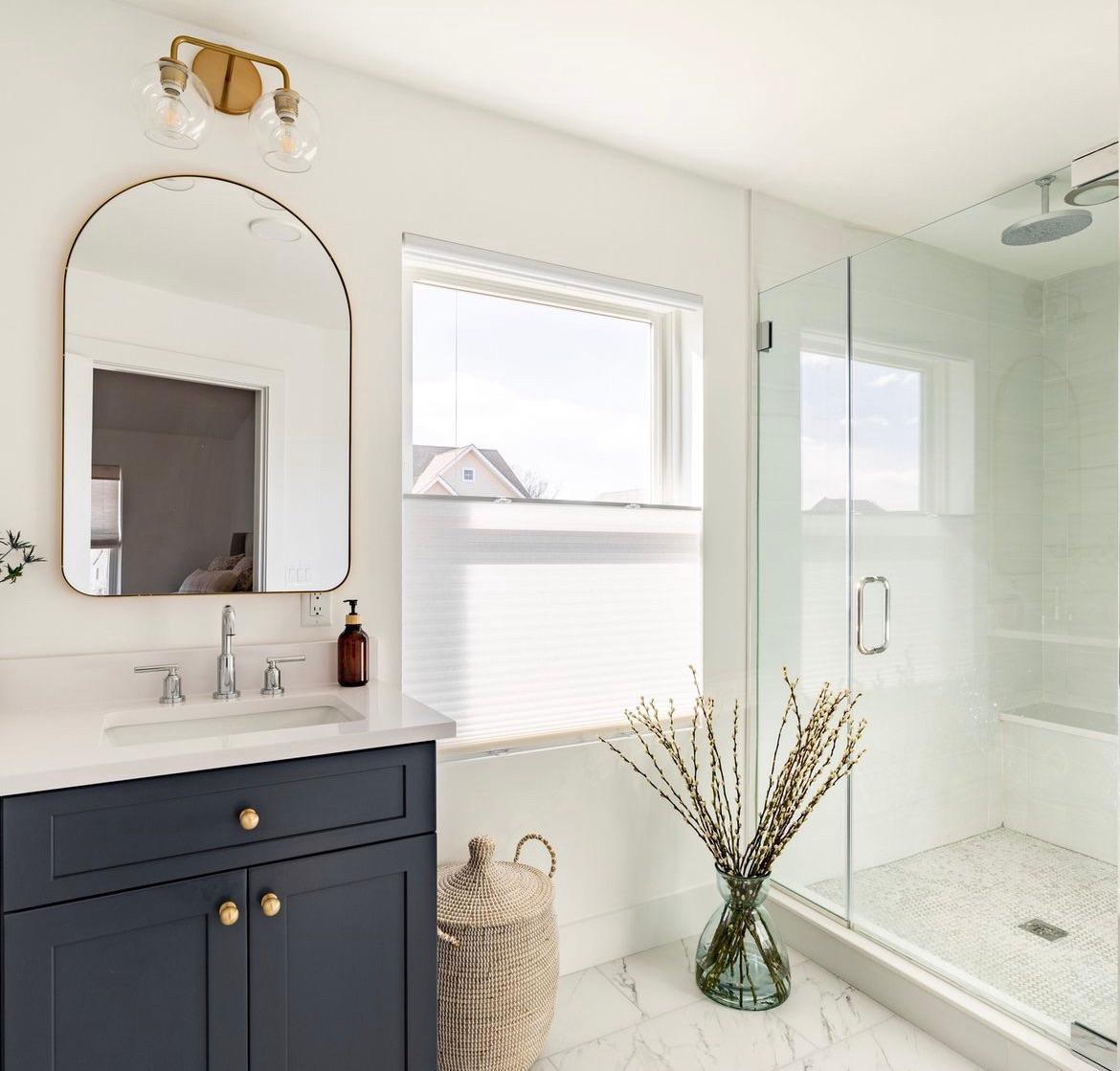 Keep the stunning views in your bathroom or powder room, while also keeping your space private with Top Down/ Bottom Up Cellular Honeycomb Shades.