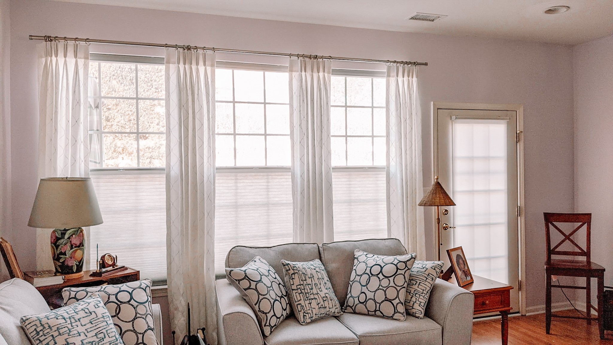 The perfect combo of drapery and honeycomb shades made this living room in Manalapan, NJ the perfect place to relax with the family.