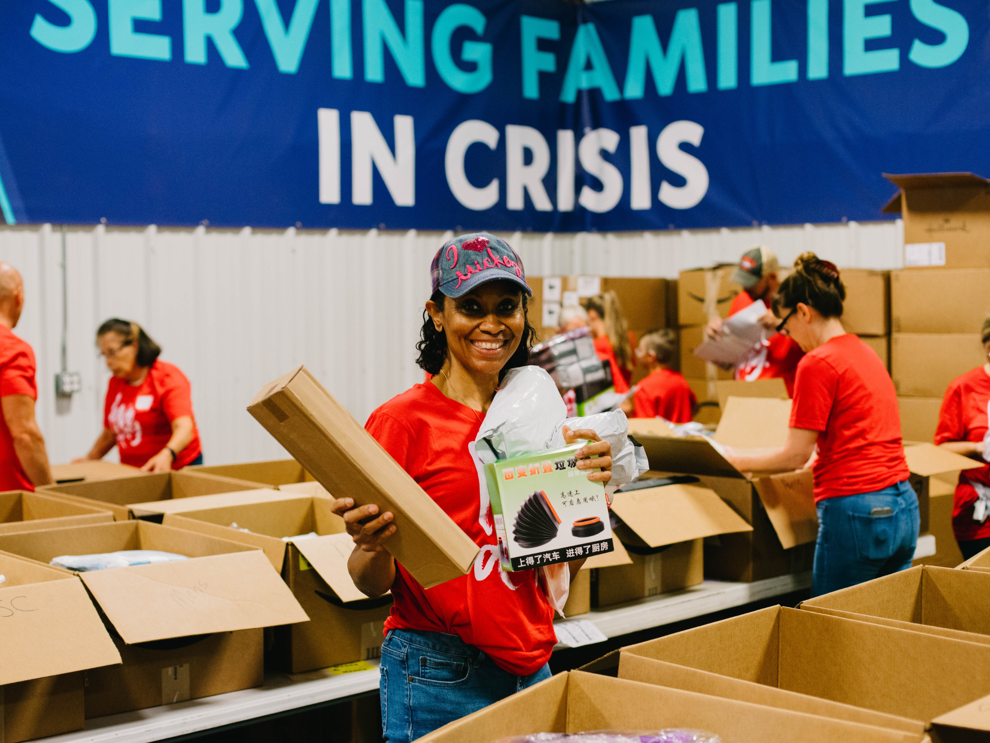 Woman filling boxes at Church on the Move Love Day in Tulsa, Oklahoma