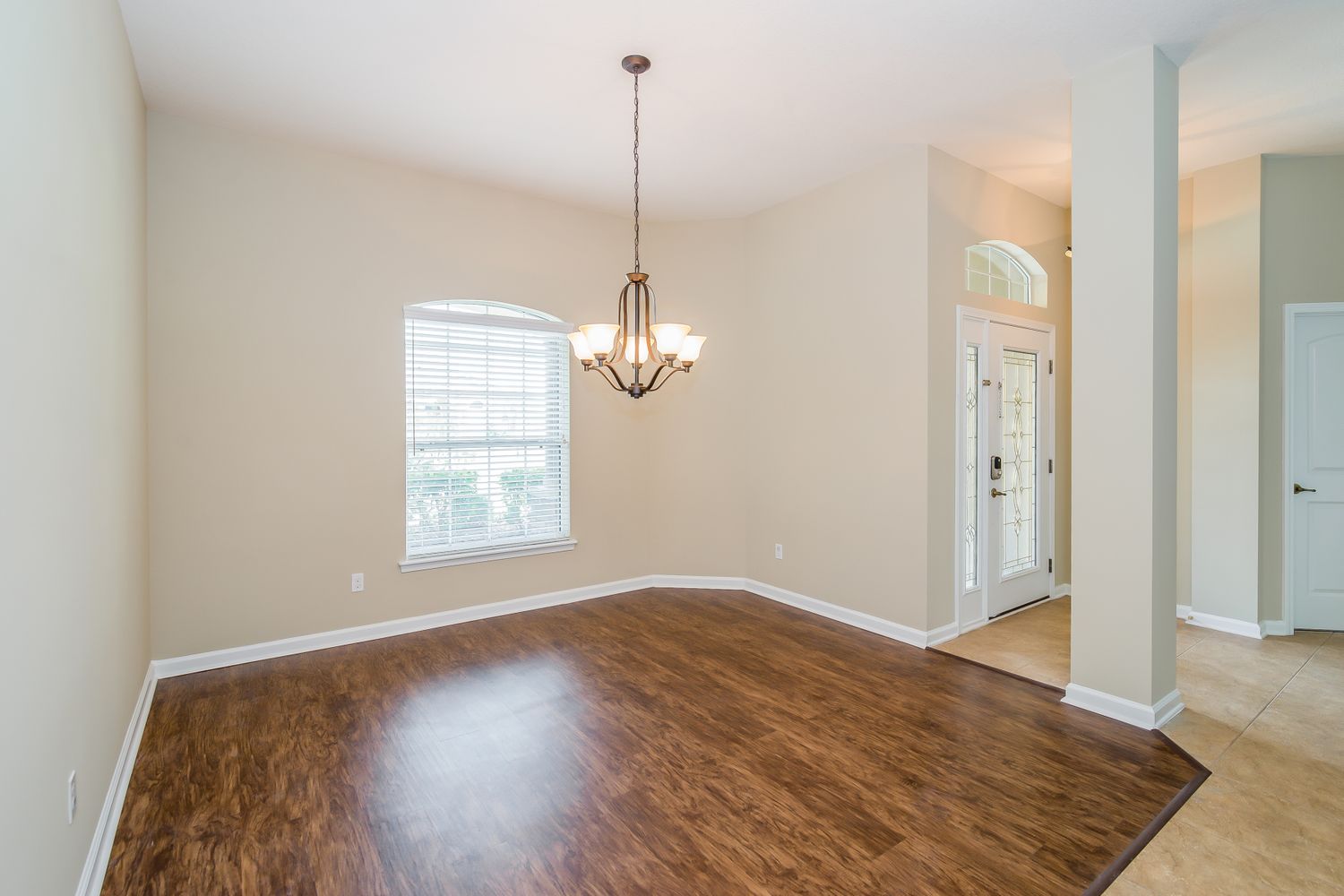 Charming dining area with wood flooring at Invitation Homes Jacksonville.