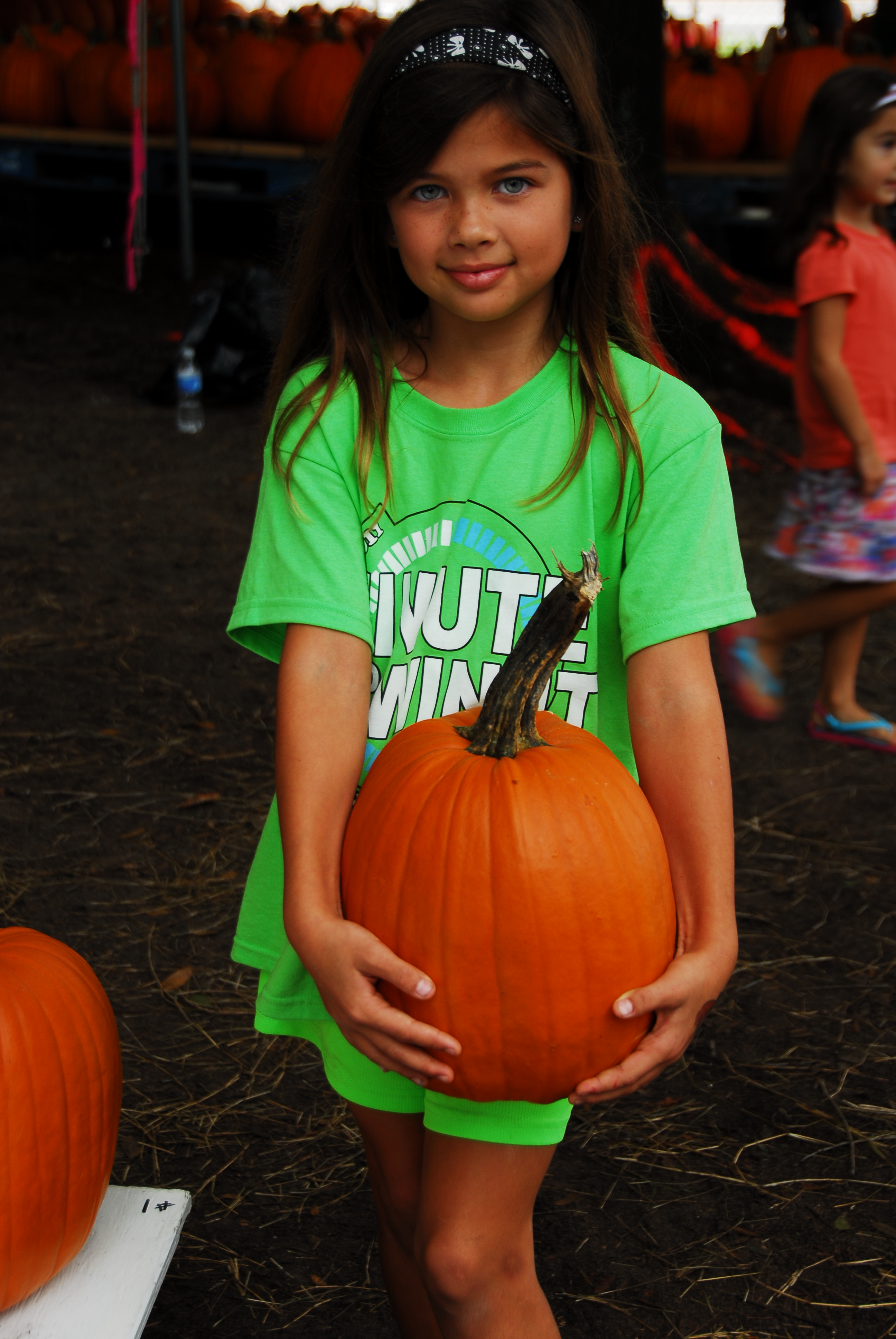 Cutie- girl - holding- beautiful- pumpkin