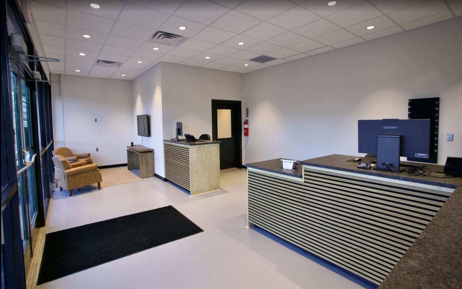 Front counter and customer service area inside Rob’e Mans Domestic Auto Repair facility in Homewood, Alabama featuring professional service advisor workstations, customer reception space, automotive branding, and a clean welcoming environment designed to provide trusted Domestic vehicle repair and maintenance services. The service advisor area supports customer scheduling, vehicle diagnostics, repair estimates, preventive maintenance planning, and professional automotive customer service for Ford, Chevrolet, GMC, Dodge, RAM, Jeep, Chrysler, Cadillac, and Buick vehicle owners throughout Birmingham and Central Alabama.