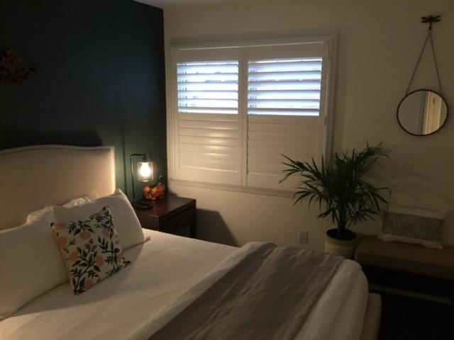 This bedroom in Croton on Hudson had Shutters installed to add clean lines for easy cleaning plus the style is just wonderful.