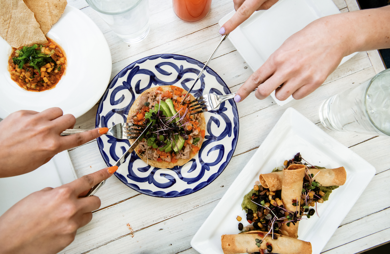 People eating a tostada