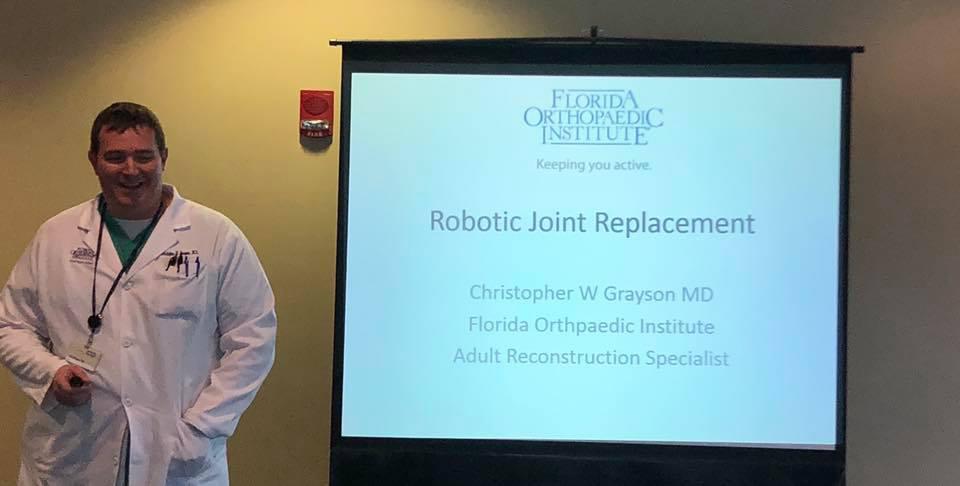 Dr. Grayson Presenting Information on Robotic Joint Replacement