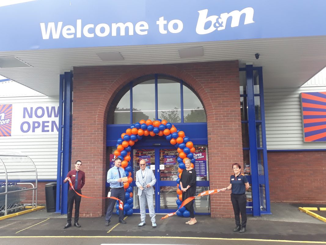 Local Hero Dale Preece-Kelly cuts the ribbon at B&M's new store in Kidderminster. Mr Preece-Kelly received £250 worth of B&M vouchers as a thank you for his hard work in the community.