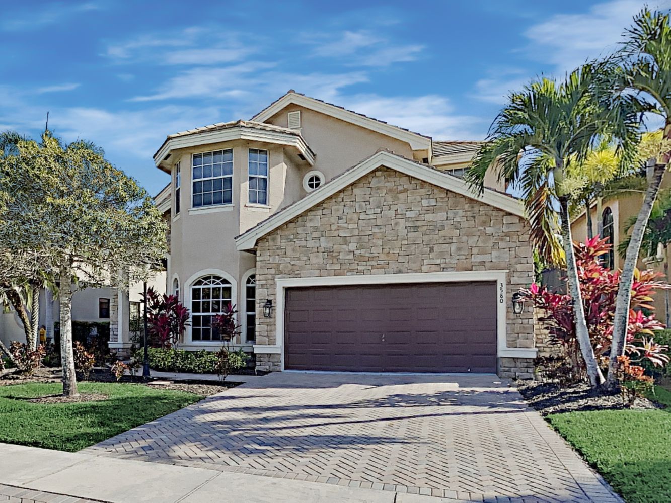 Stunning two-story home with a large garage at Invitation Homes South Florida.