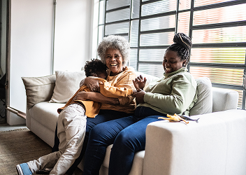 A multigenerational family laughing together.