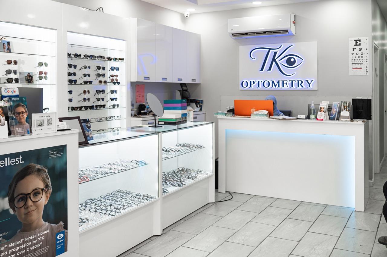 Modern TK Optometry optical store in Brooklyn with reception desk, eyeglass displays, and designer e 