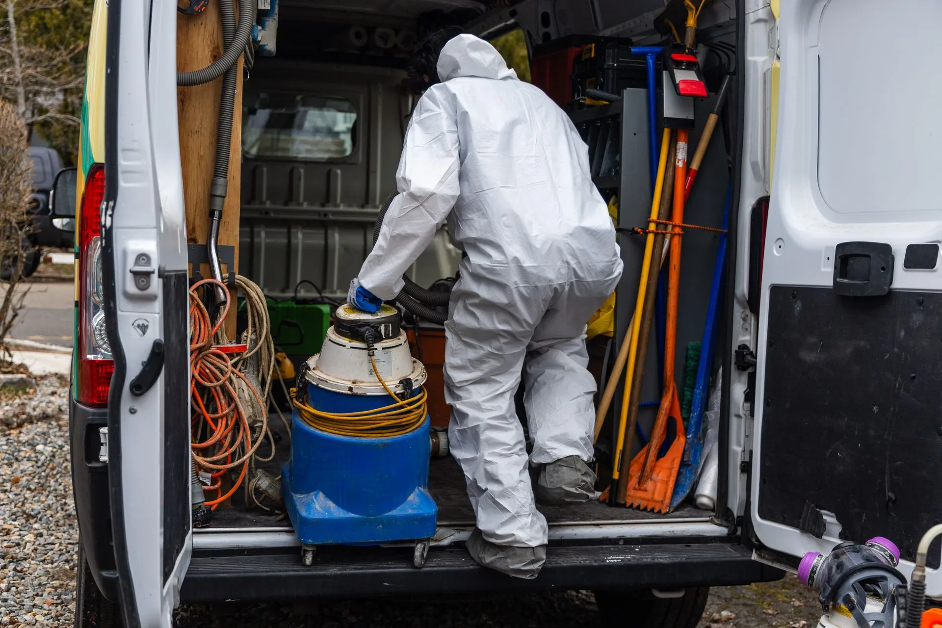 A CT Mold Remediation Specialists technician prepares containment and HEPA filtration equipment for  
