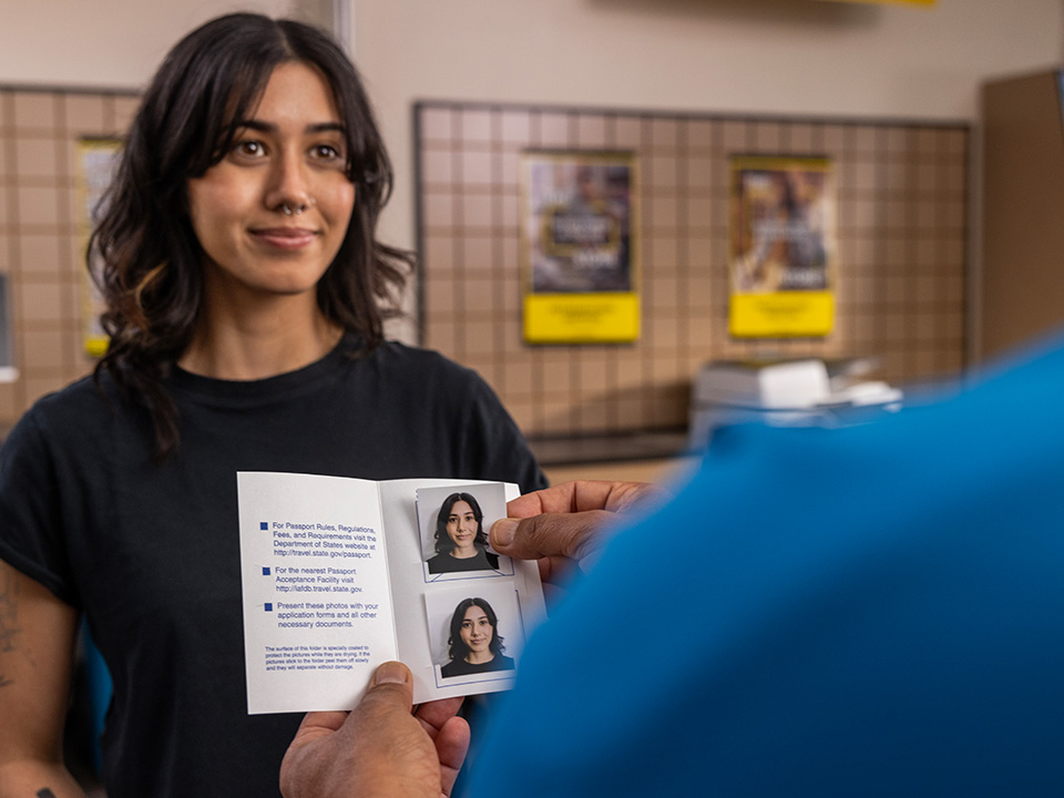 Woman getting new passport photo at the UPS Store