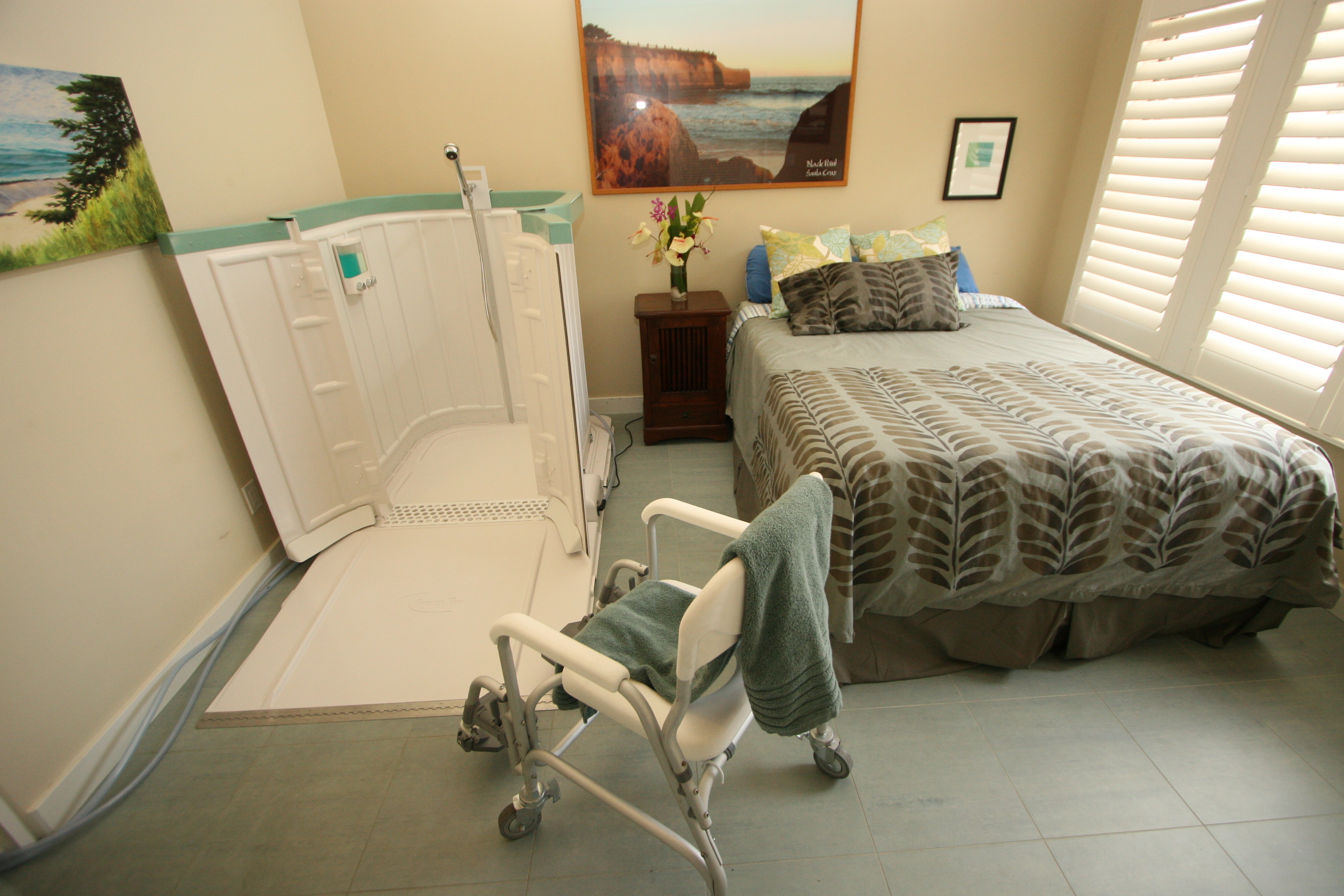 Portable Shower Bay system set up in a bedroom, providing a safe and convenient bathing solution for individuals with limited mobility or recovering at home.