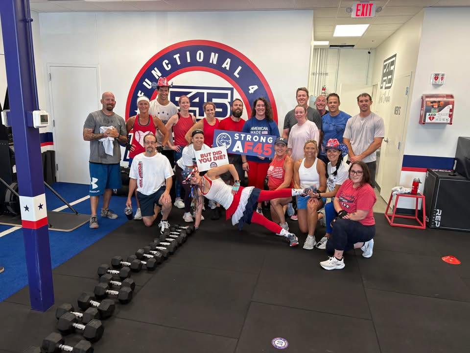 F45 Training West Omaha members and trainers gathered inside the Omaha fitness studio. 