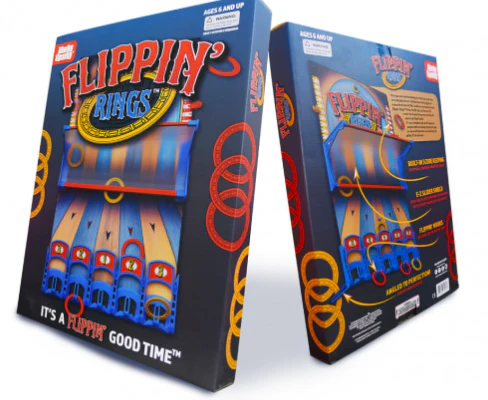 Marky Sparky | Flippin' Rings With hand-eye coordination, a little skill, and a bit of luck, players can score big in this carnival-inspired game! Families of all ages have a flippin' good time tossing the rings onto the hooks and using the built-in score keeper to track points. An E-Z slider shield helps keep rings on the board and the plastic stand is perfectly angled for maximum success. Some adult assembly required.