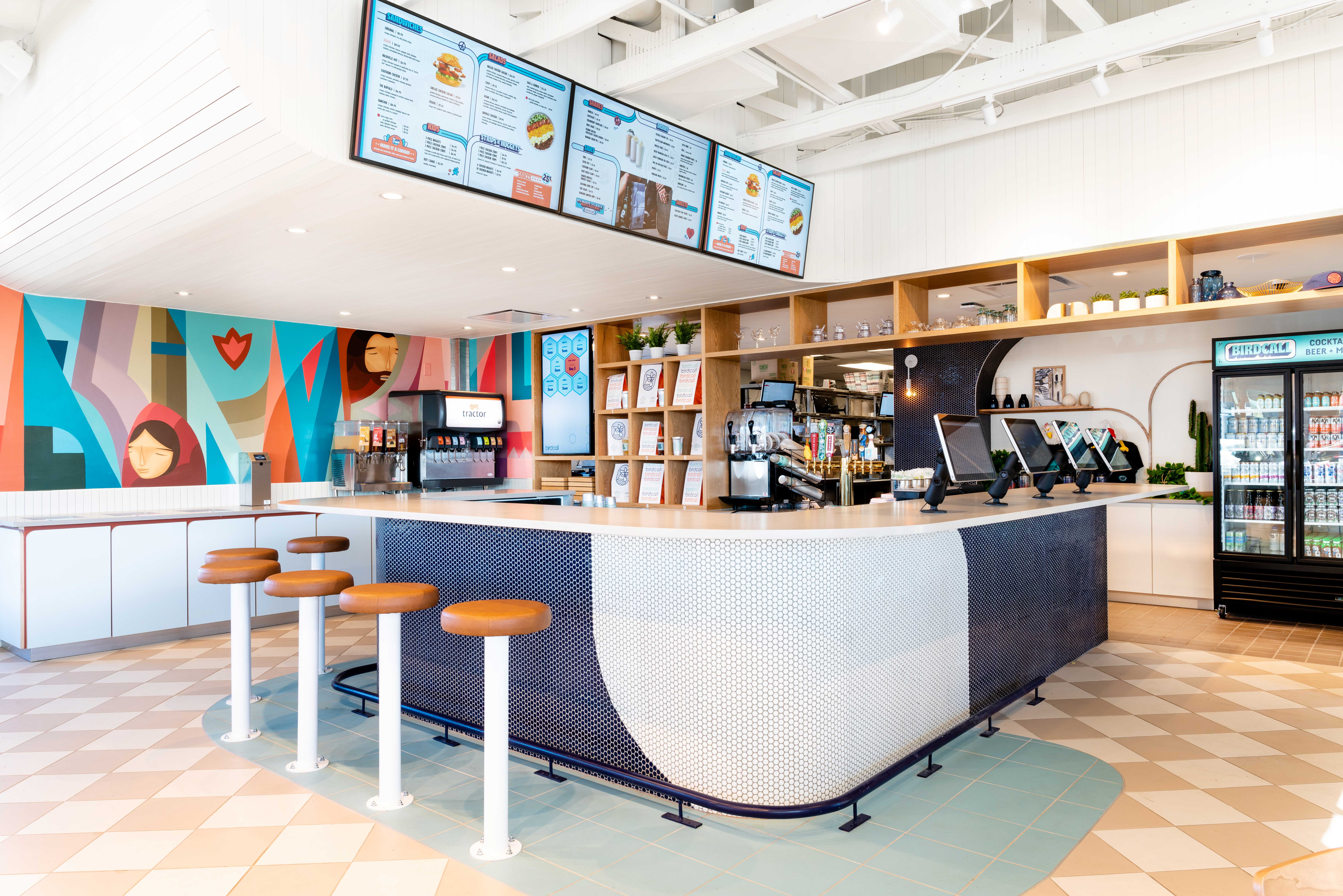 Interior of Birdcall Colorado Springs, highlighting the bar area, ordering system, and food pick up bays.