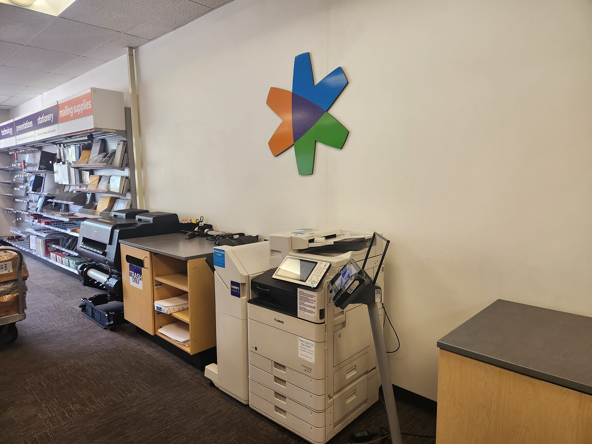 Self-Service Copier and Printing Station &ndash; Self-service copier and printer area for walk-in customers needing fast printing and copying services.