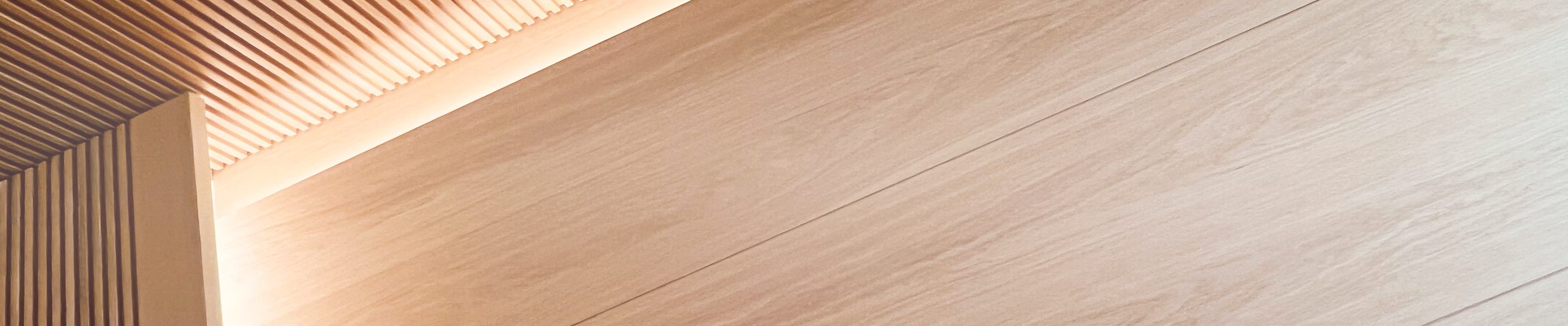 Architectural wood slat ceiling with dramatic light and shadow interplay.