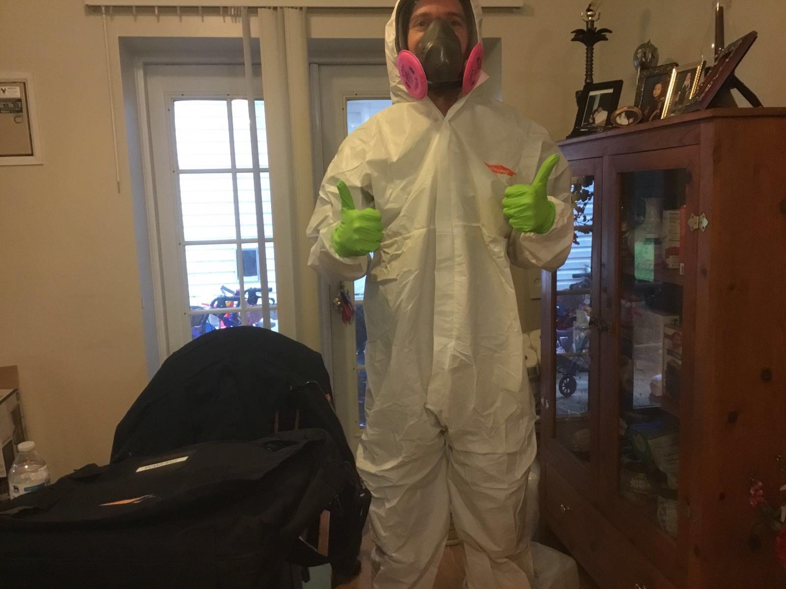 SERVPRO of Charlottesville technician in full PPE, "Here to Help" with your Biohazard, sewage back up, mold remediation, COVID-19 disinfecting, fire and water damage restoration.