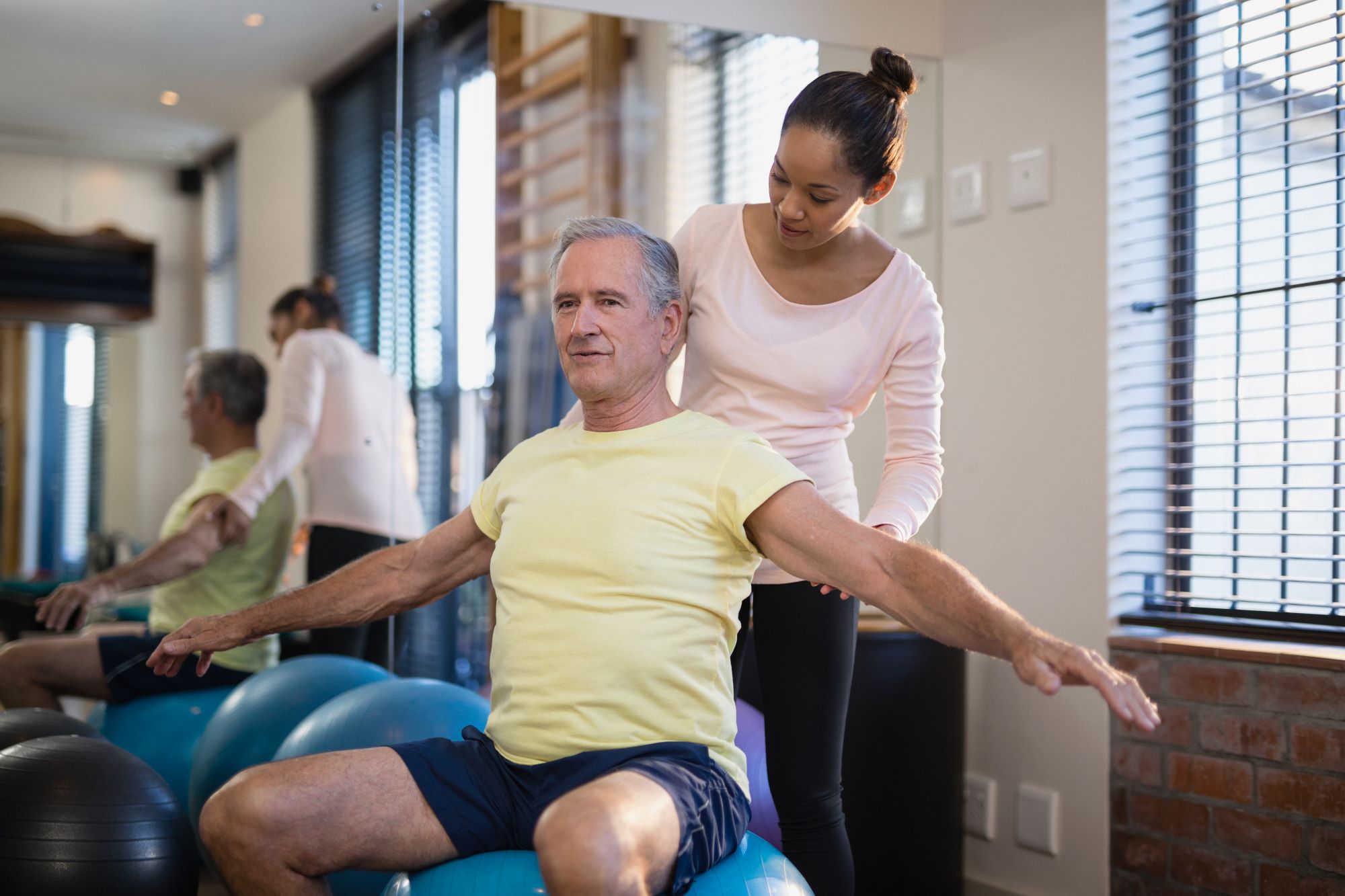 Elderly man during a physical therapy sessions in Logan