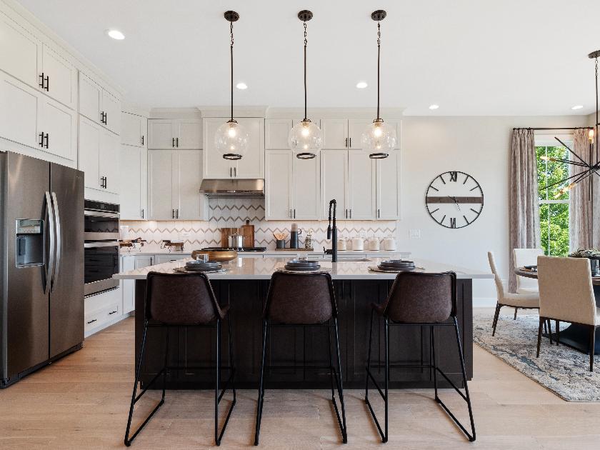 Gourmet kitchens with Whirlpool® stainless steel appliances, luxury vinyl plank flooring, 42" Timberlake cabinets, granite countertops, and more