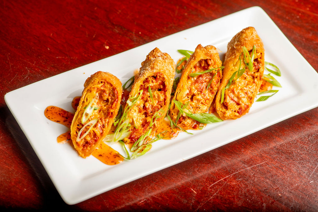 Chicken & Andouille Spring Rolls: blackened chicken, sharp cheddar, sweet chili sauce