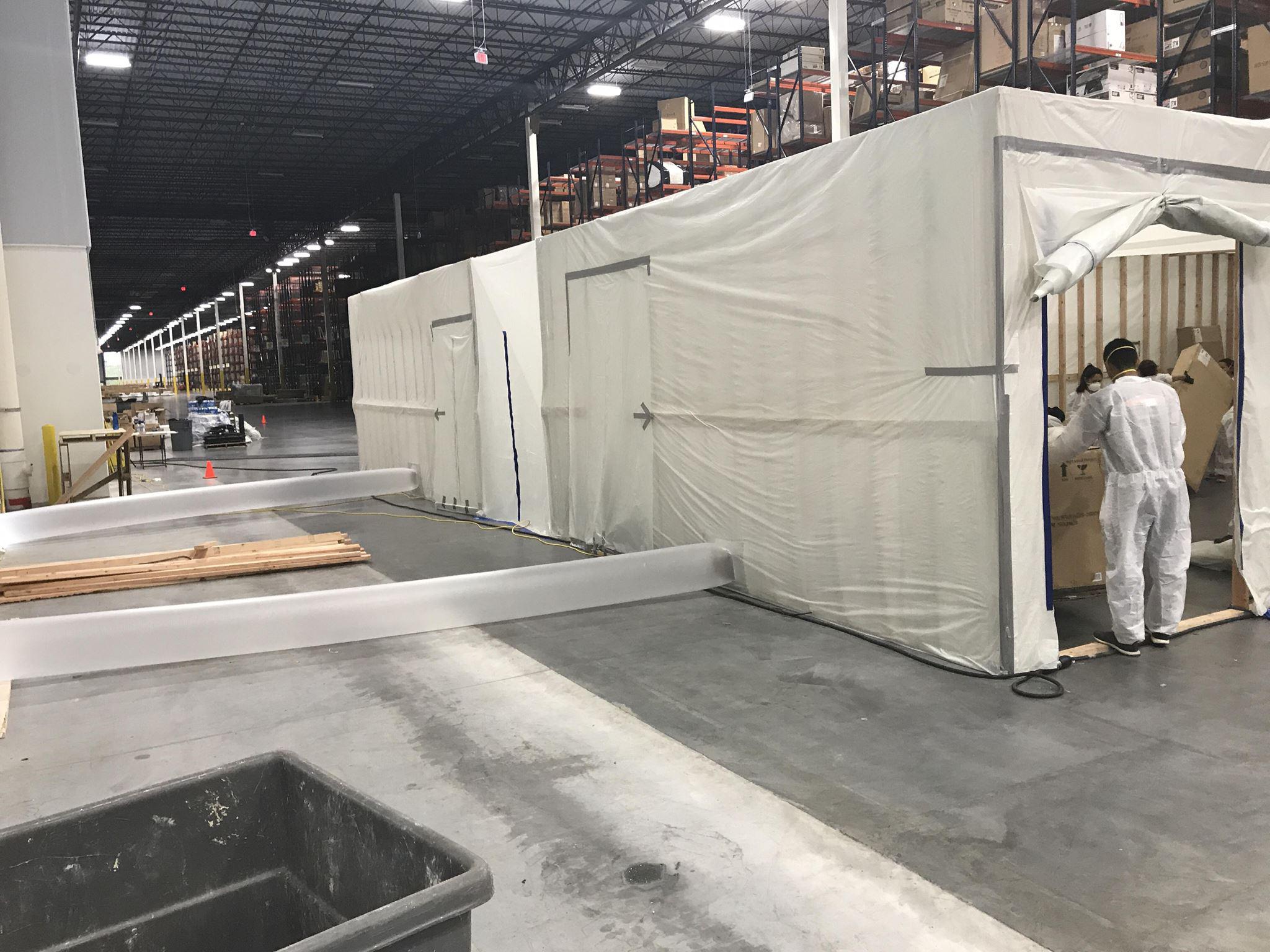 SERVPRO crew in the process of mold remediation services for large warehouse facility.