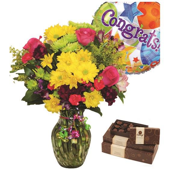 Celebrate The Day Congrats Bundle - Our bright & colorful bouquet of fresh carnations, daisy poms and more—complete with a festive Congrats balloon and a gourmet box of chocolates —lets them know it's their day to shine.