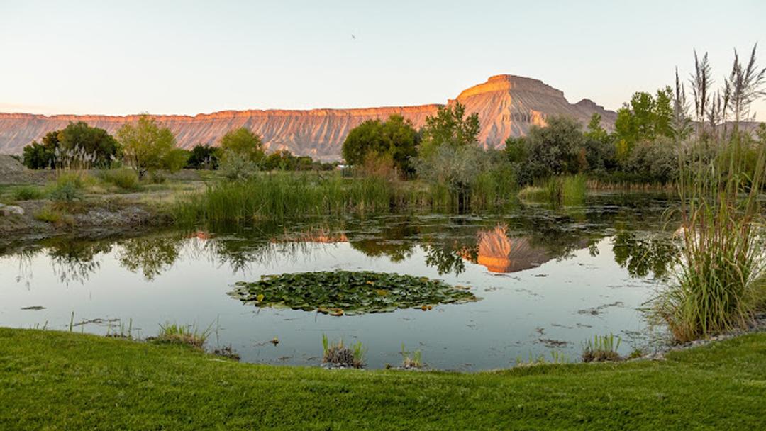 Pond on the TWP Winery Estate surrounded by the Book Cliff mountains