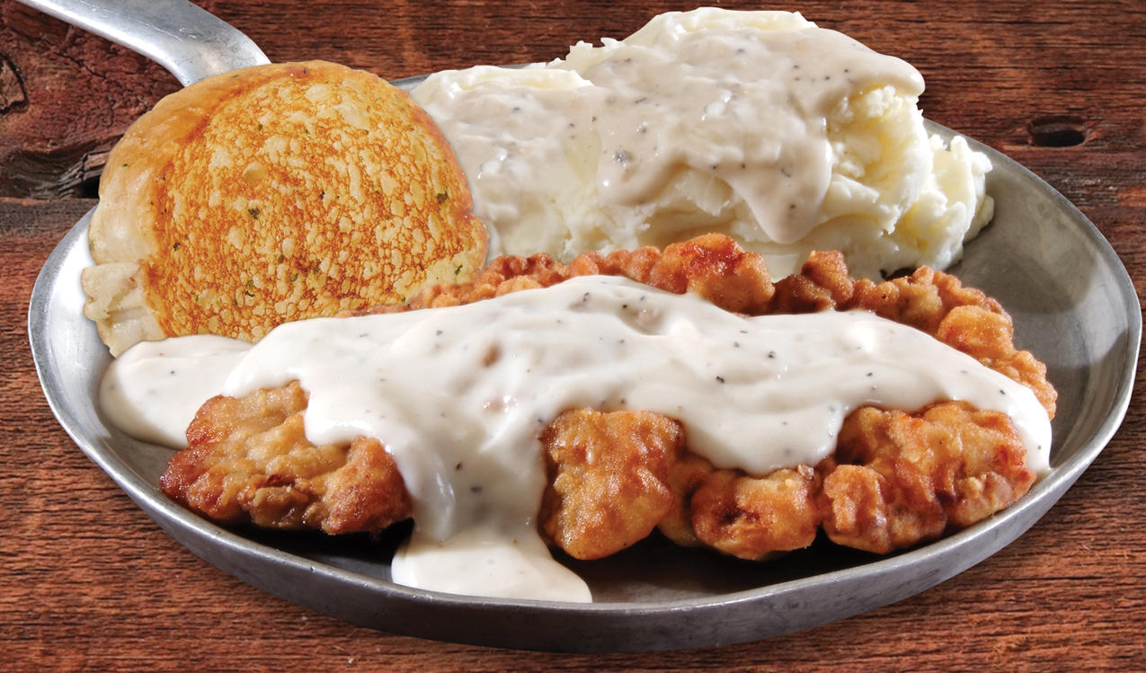 Chicken-Fried Steak - Our famous classic chicken-fried steak recipe served with creamy country gravy Iron Skillet McCalla (205)477-9178