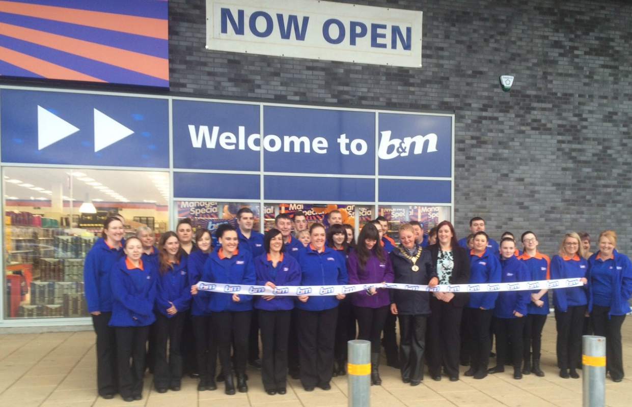 The store being opened by Lord Provost Anne Hall & representatives from Erskine Proud to Care Charity who gratefully accepted £250 of B&M vouchers.