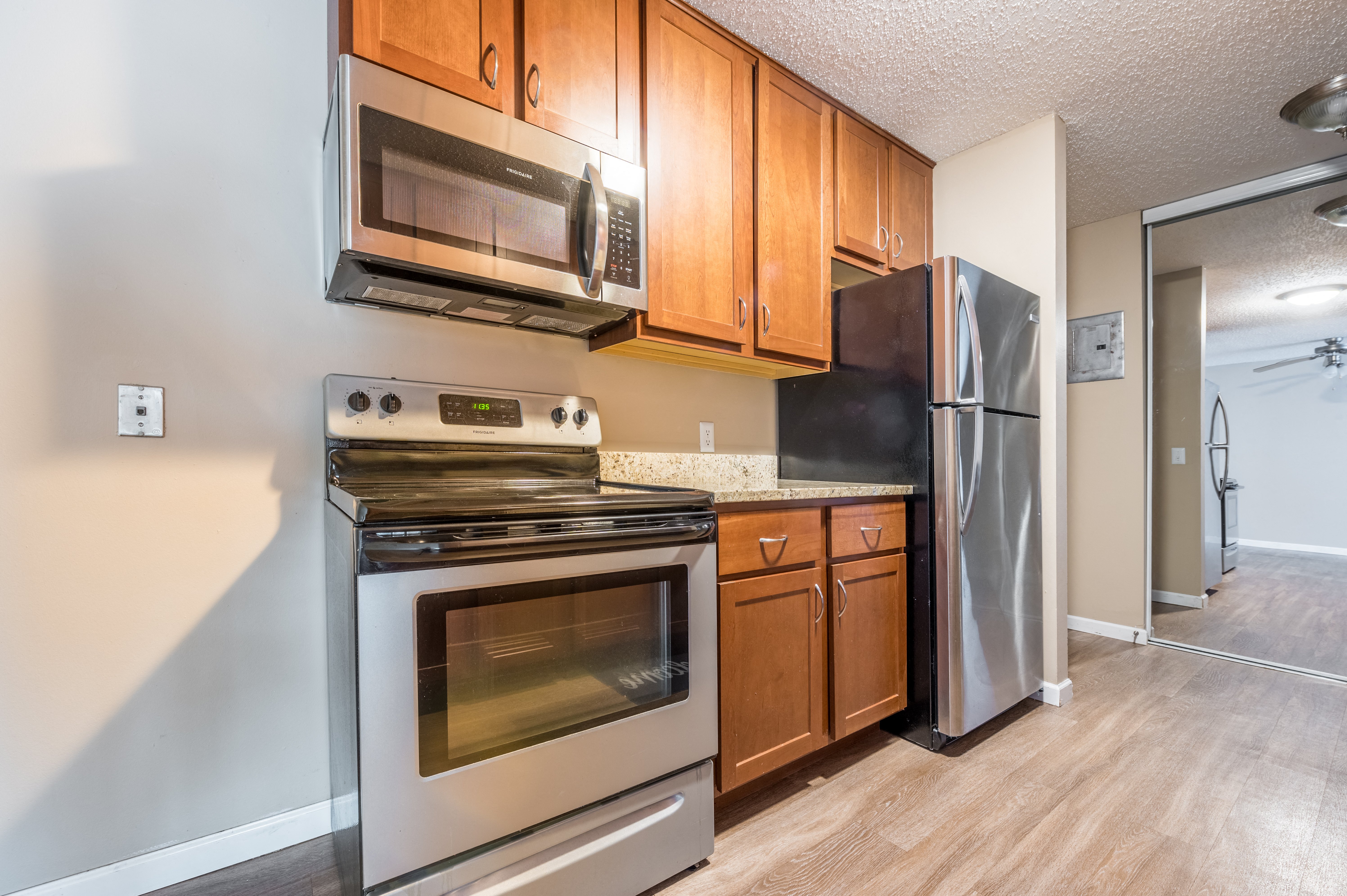 a kitchen with wooden cabinets at Heritage Hills Apartments, Bloomington, 55437