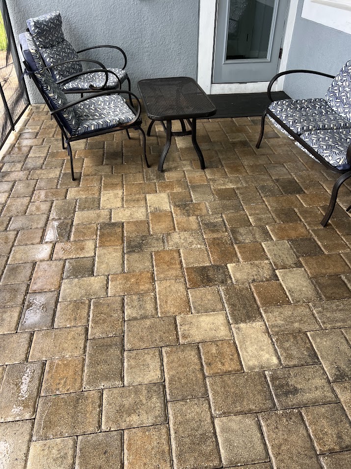 Professional patio pressure washing in Kissimmee, FL, removing dirt, algae, mildew, and outdoor buildup.