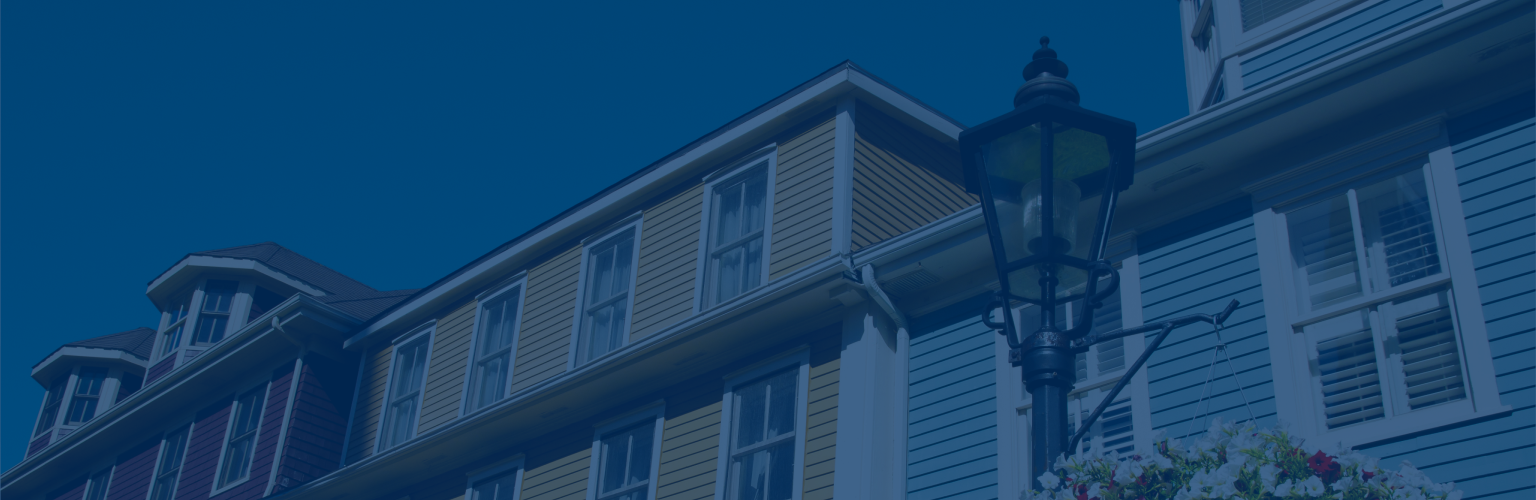 Close-up of a row of colourful Victorian clapboard houses.