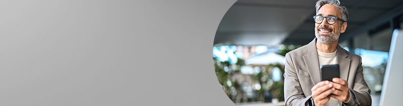 A man n Chico with smiles when booking his hearing appointment at AudioNova