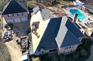 Installing a residential roof in a North Sandy Creek Road neighborhood in Biloxi