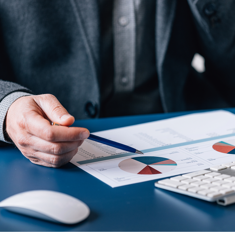 Close-up of an investment professional reviewing client documents.