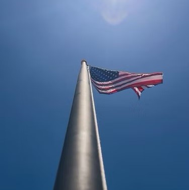 Burk Flagpole offers professional flag pole installation services to help you proudly display your flags. Our team is dedicated to ensuring your flag pole is securely and properly installed, adding a polished and professional touch to your property.