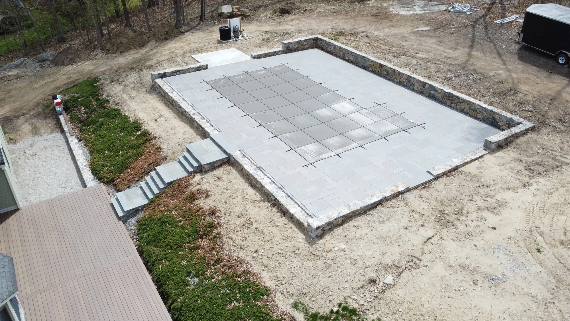 Aerial view of a custom paver pool deck - Paver Pool Decks project by General Masonry LLC.