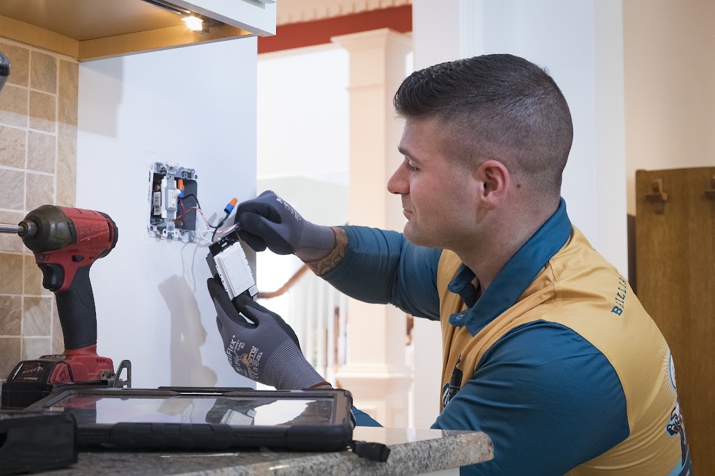 Thomas Edison Electric electrician installing and wiring a light switch as part of residential electrical service work in Pennsylvania