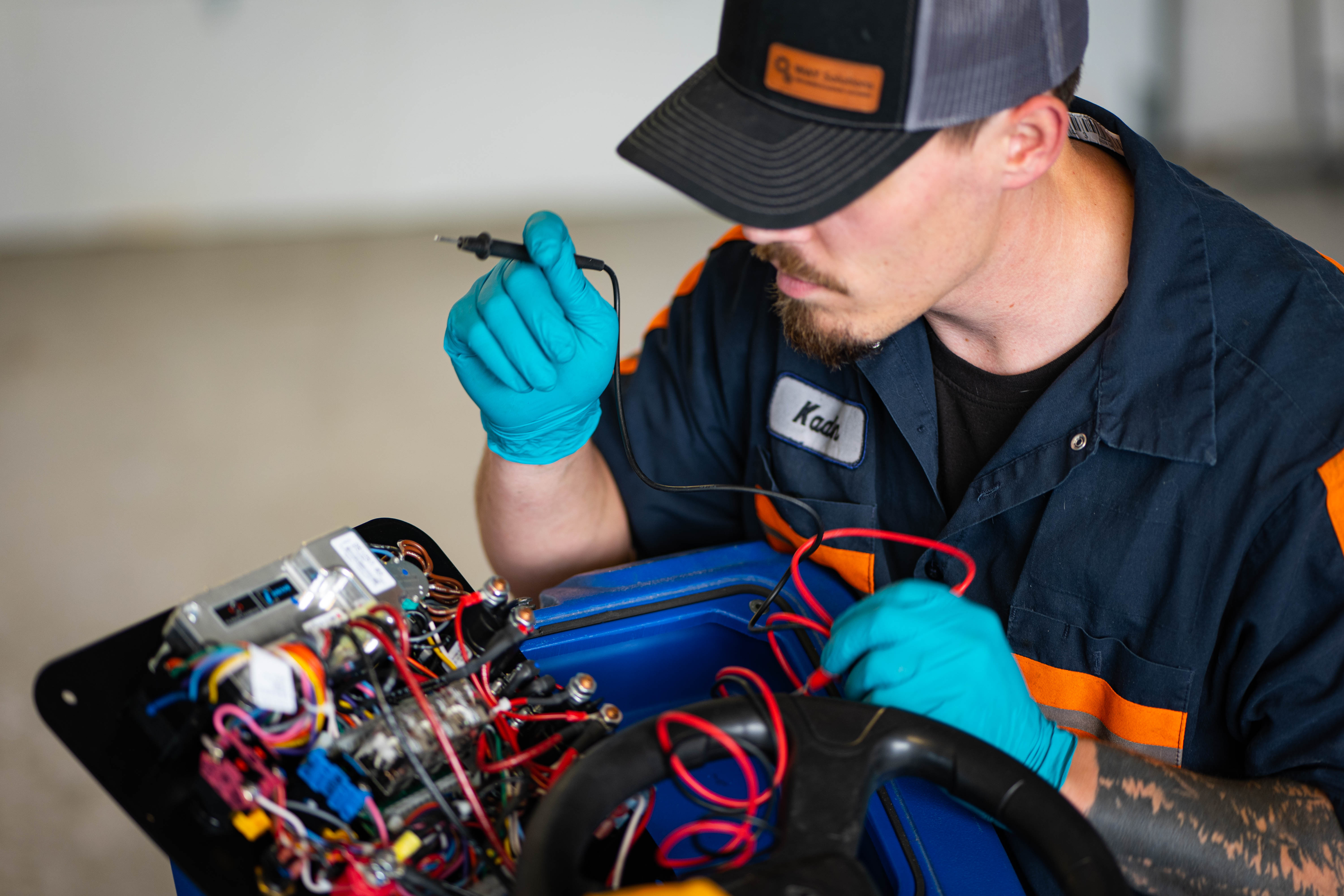 WaySolutions lead technician Kaden prepares to perform high-level electrical diagnostics on a commercial floor scrubber. Our team specializes in troubleshooting complex supermarket cleaning fleets, ensuring every machine is tested for safety and peak operational efficiency using professional-grade diagnostic tools.