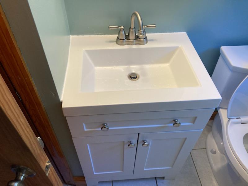 For this project in Tewksbury, MA, our handyman remodeled two bathrooms for the happy homeowner. We added two vanities, two toilets, and two medicine cabinets. We also put in new flooring for both bathrooms.