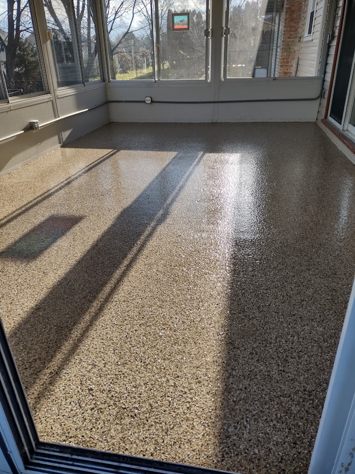 Custom Sedona Flake Epoxy 3-season patio floor in State College, PA to bring 2021 to a close!  Happy New Year!