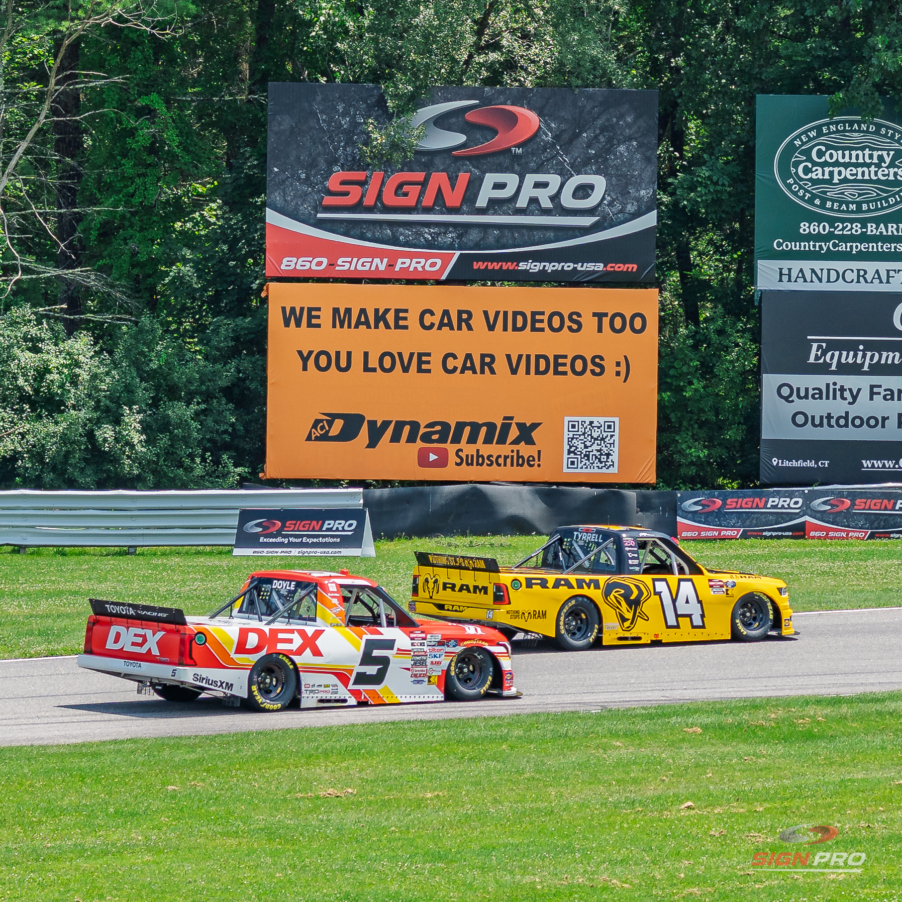 Trackside sponsorship banners produced by Sign Pro and displayed throughout the infield at Lime Rock Park during the NASCAR Craftsman Truck Series LiUNA! 150.