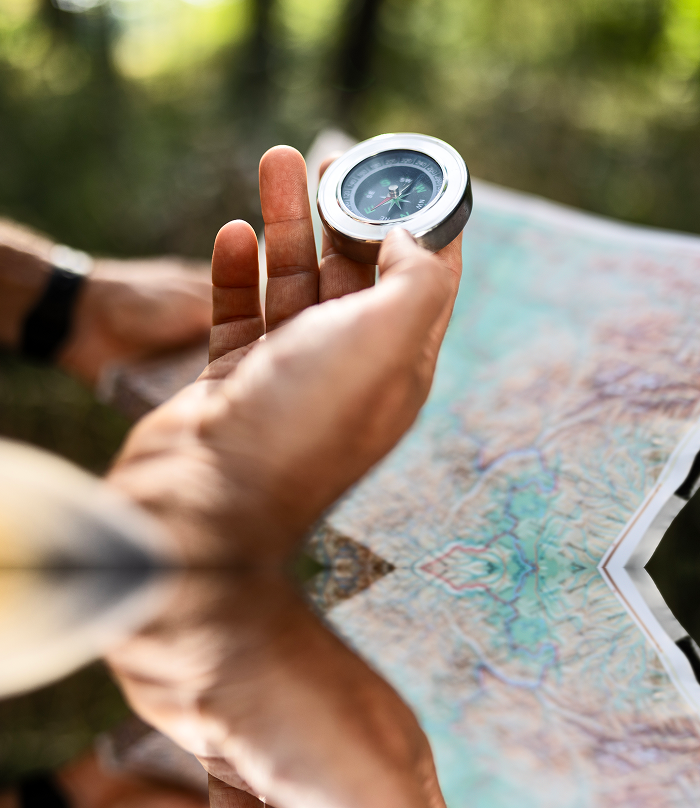 Close up of someone holding a compass.