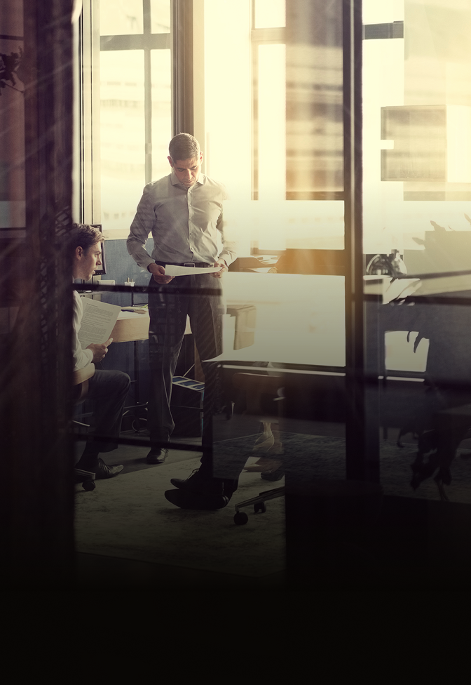 Show of two professionals collaborating in an office setting.