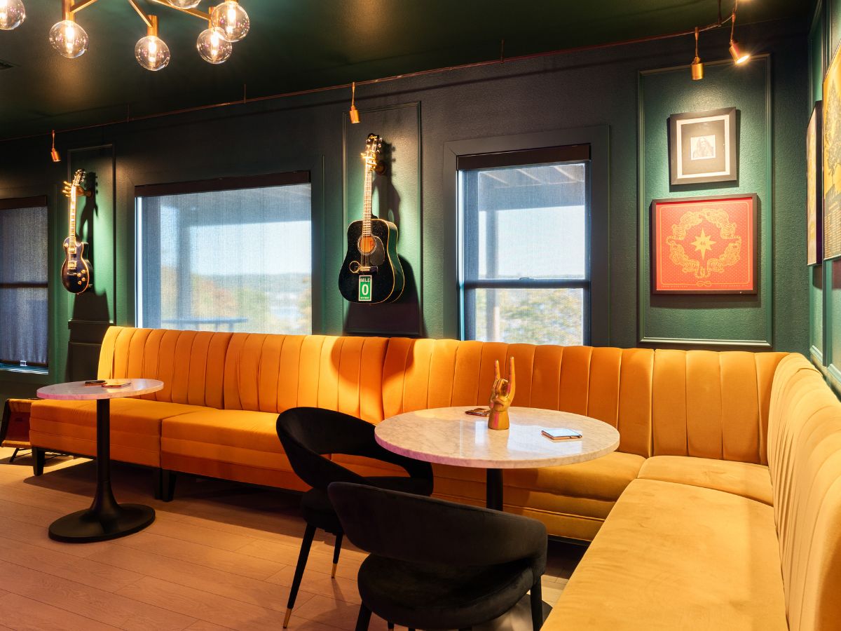 Black roller shades in colorful speakeasy.