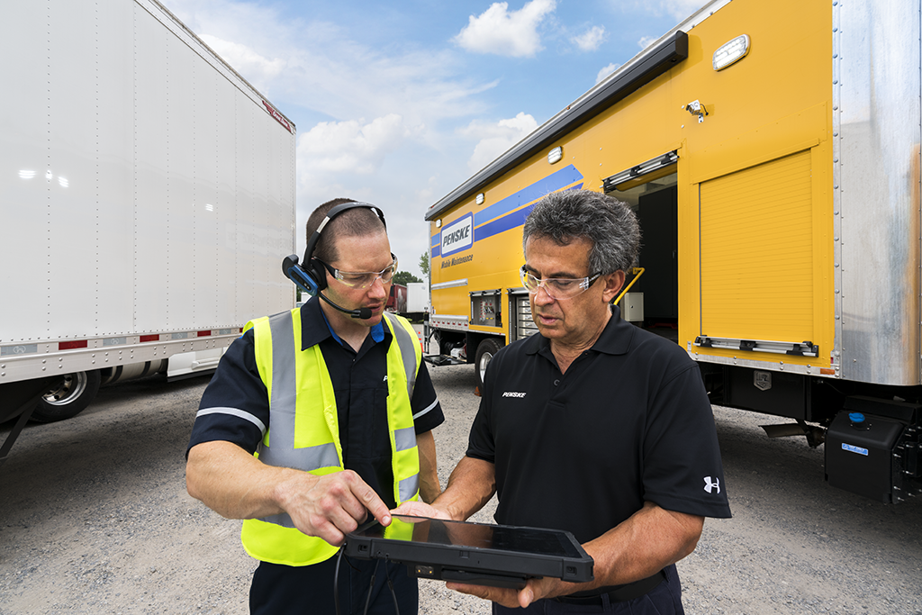 On site truck and trailer repair action image of Penske technicians in the midst of a local service call.
