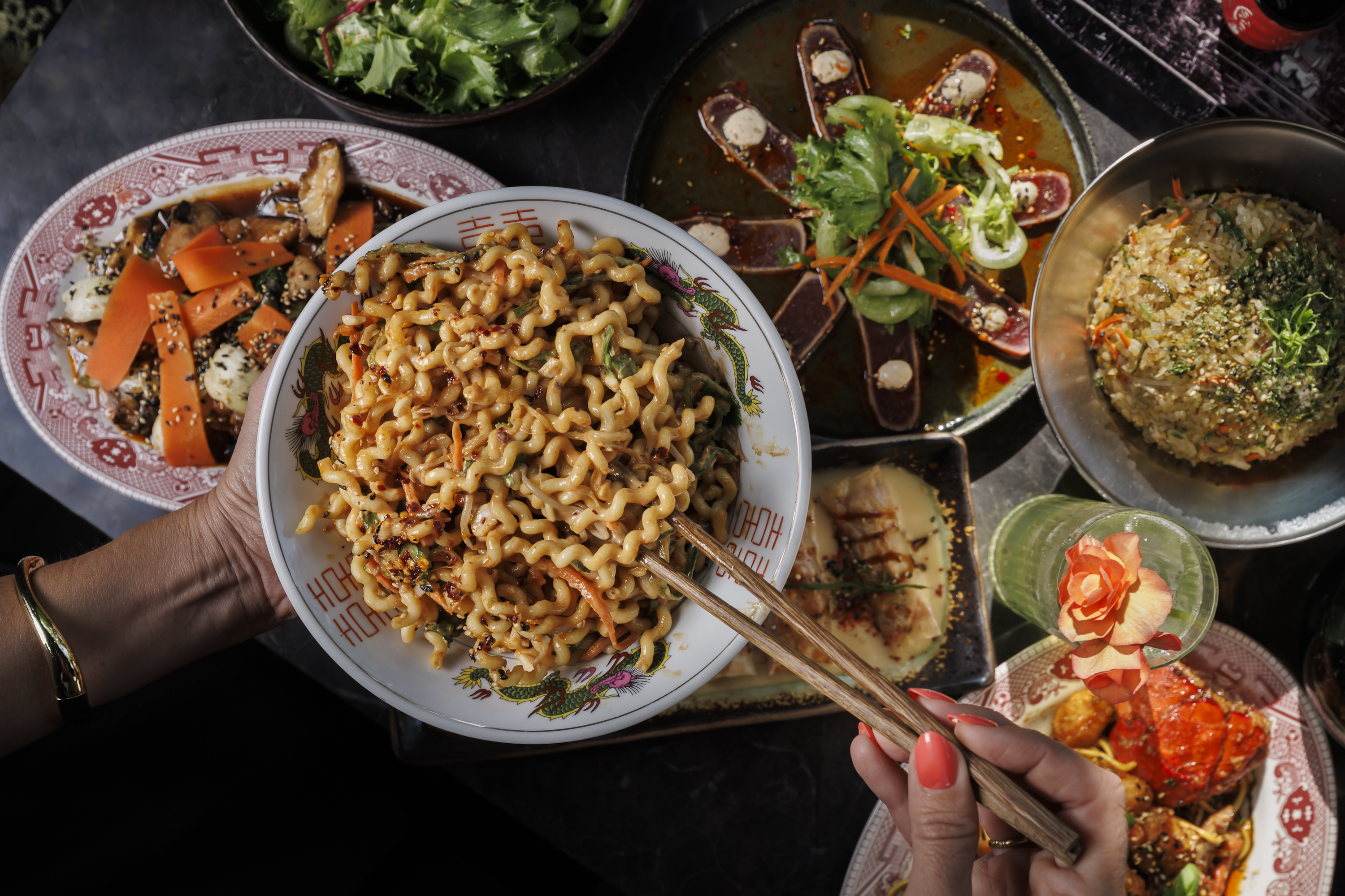Spicy Peanut Noodles: Curly spindle noodles, peanut-hoisin sauce, chili oil, mint & cilantro, peanuts