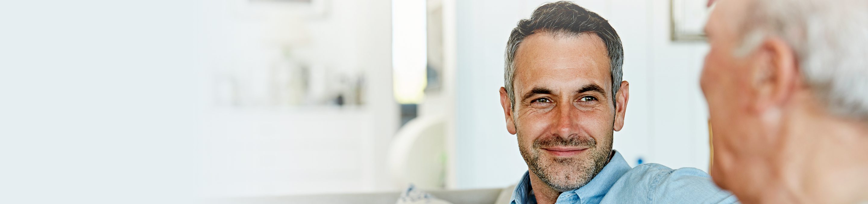 An advisor speaking with an elderly client.